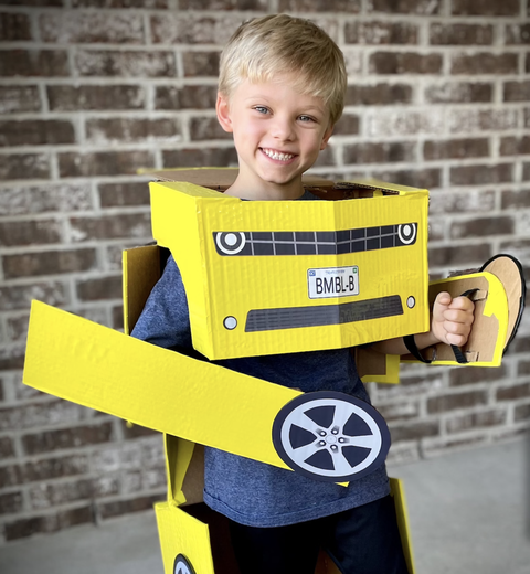 transformers halloween costume ideas, boy dressed in diy bumblebee outfit