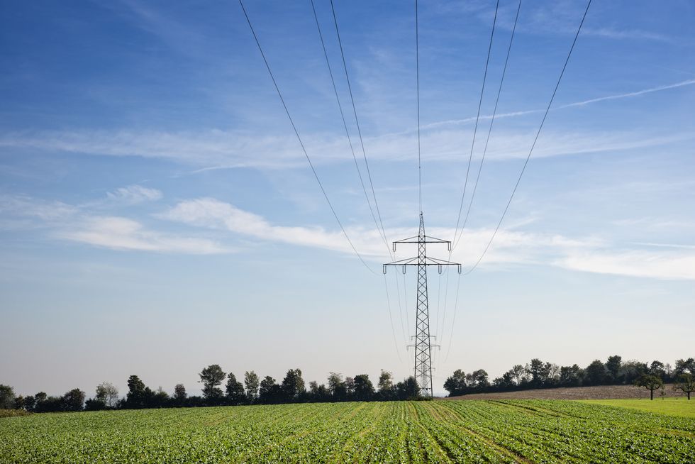 transmission towers and power lines in agricultural fields