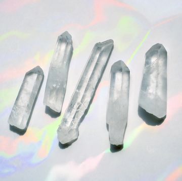 transparent quartz crystals with rainbow light background