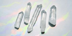 transparent quartz crystals with rainbow light background