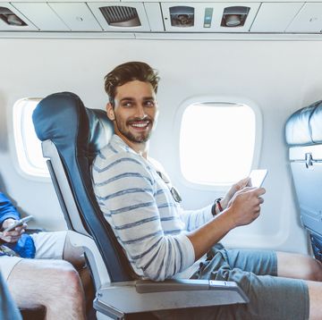 traveler in flight with digital tablet