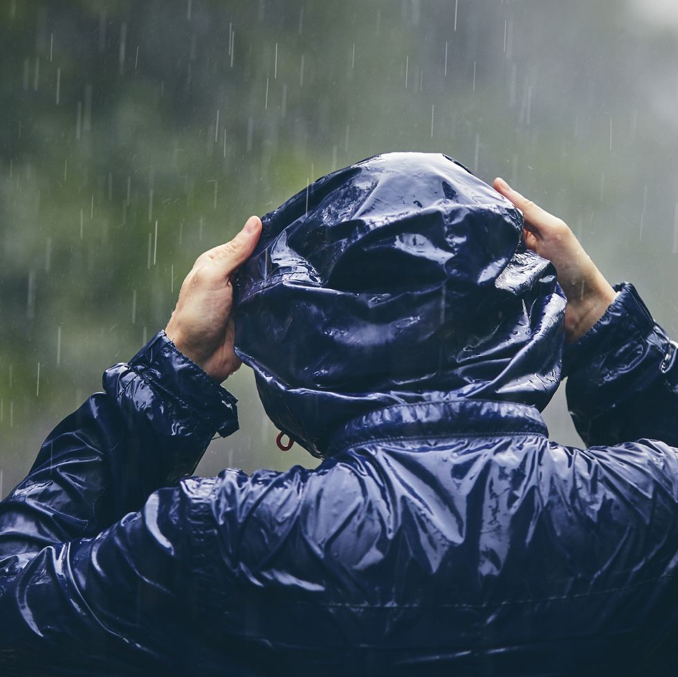 traveler in heavy rain