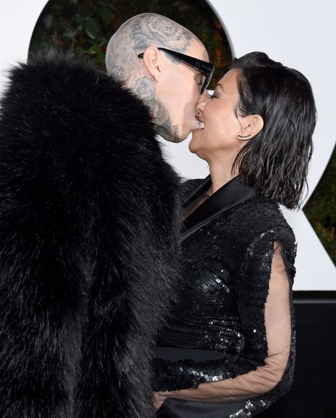 kourtney kardashian and travis barker kissing at the 2022 gq men of the year party hosted by global editorial director will welch