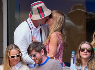 taylor swift and travis kelce kiss during the 2024 us open tennis championships