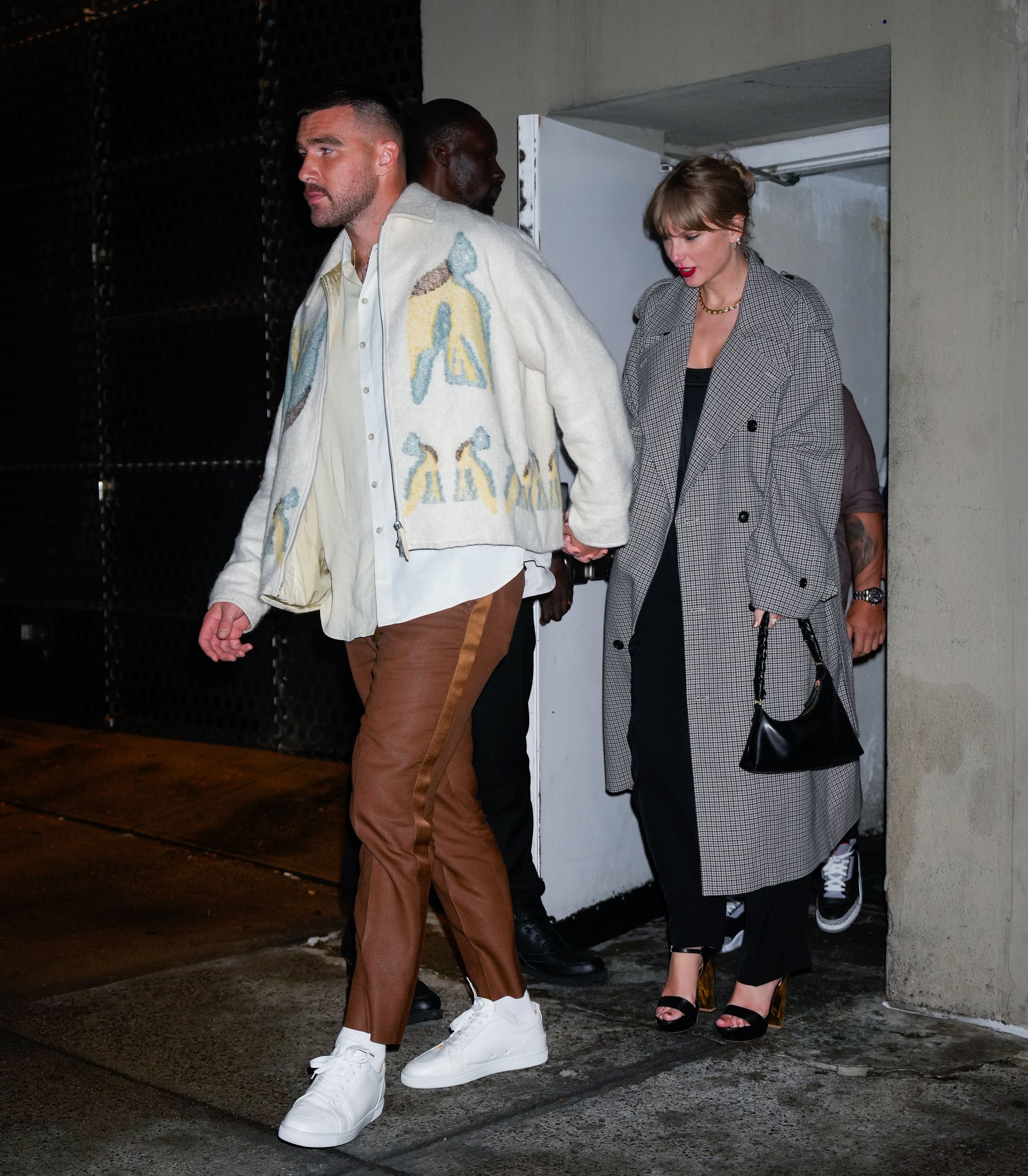 Taylor Swift and Travis Kelce photographed holding hands for the