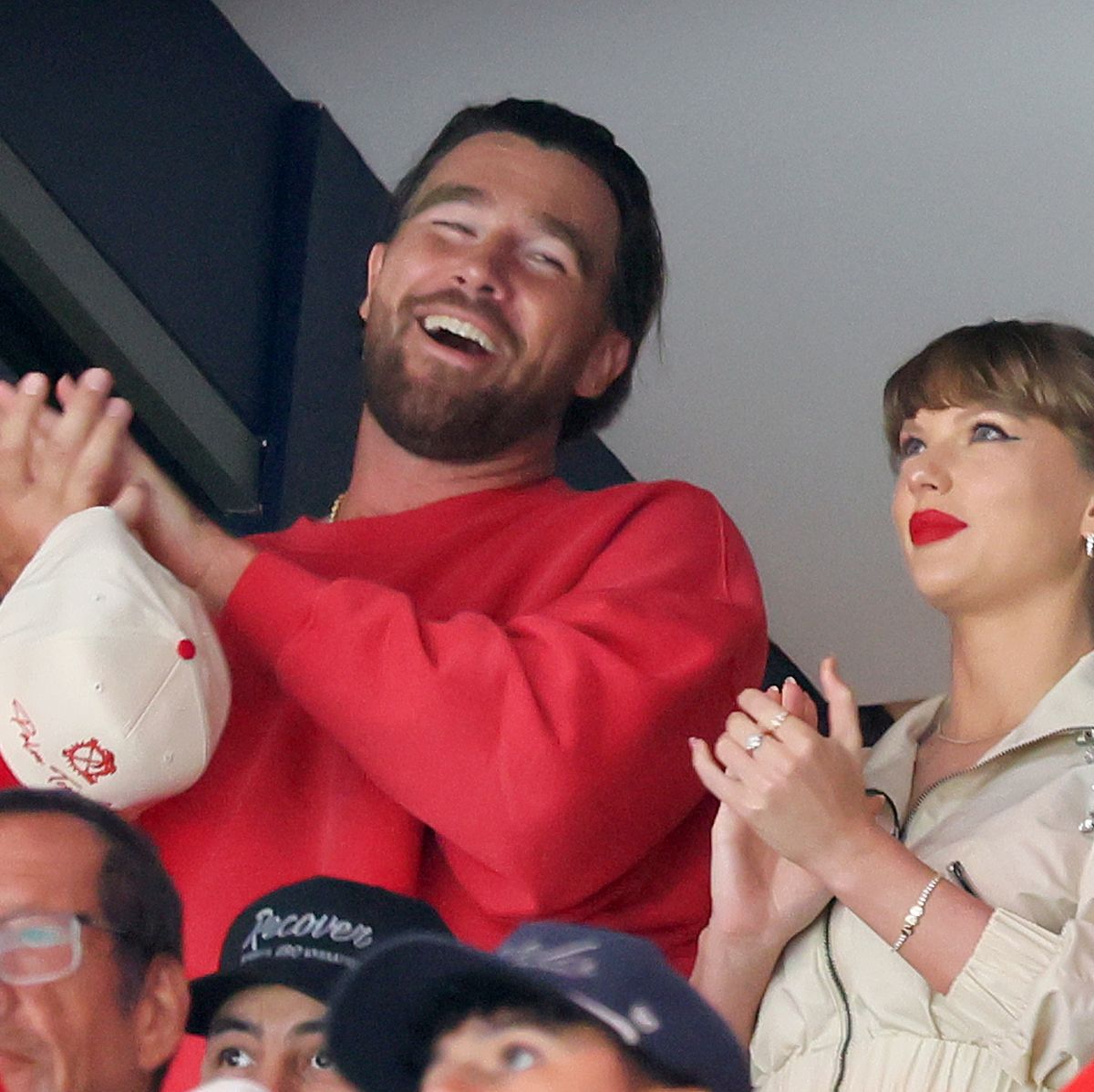 travis-kelce-left-and-taylor-