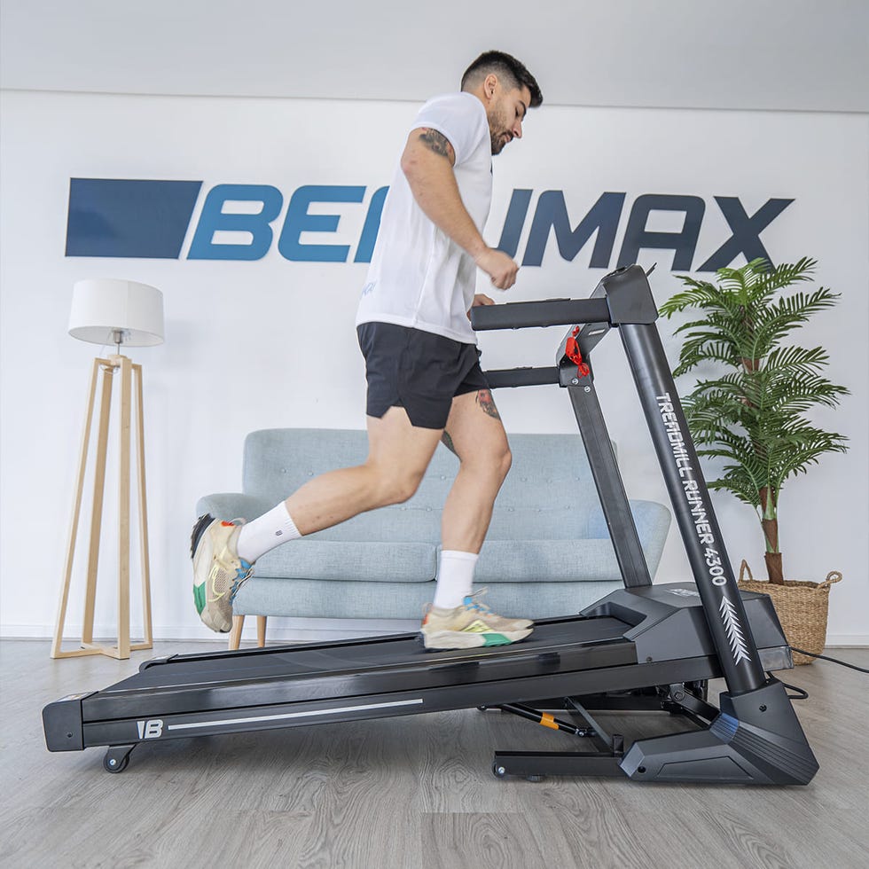 individual running on a treadmill in a modern indoor setting