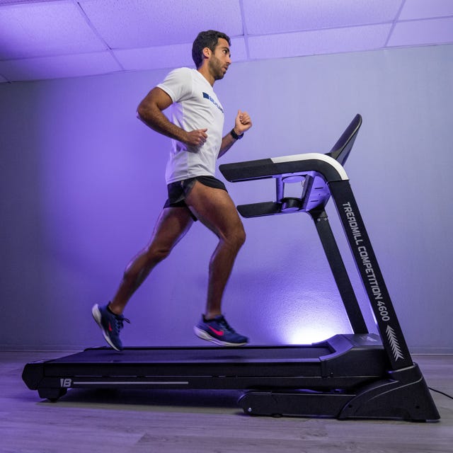 individual running on a treadmill in a fitness setting