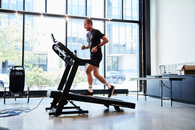 a person running an incline on a treadmill
