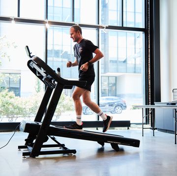 a person 30I9827 running an incline on a treadmill