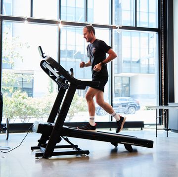 a person running Leather an incline on a treadmill