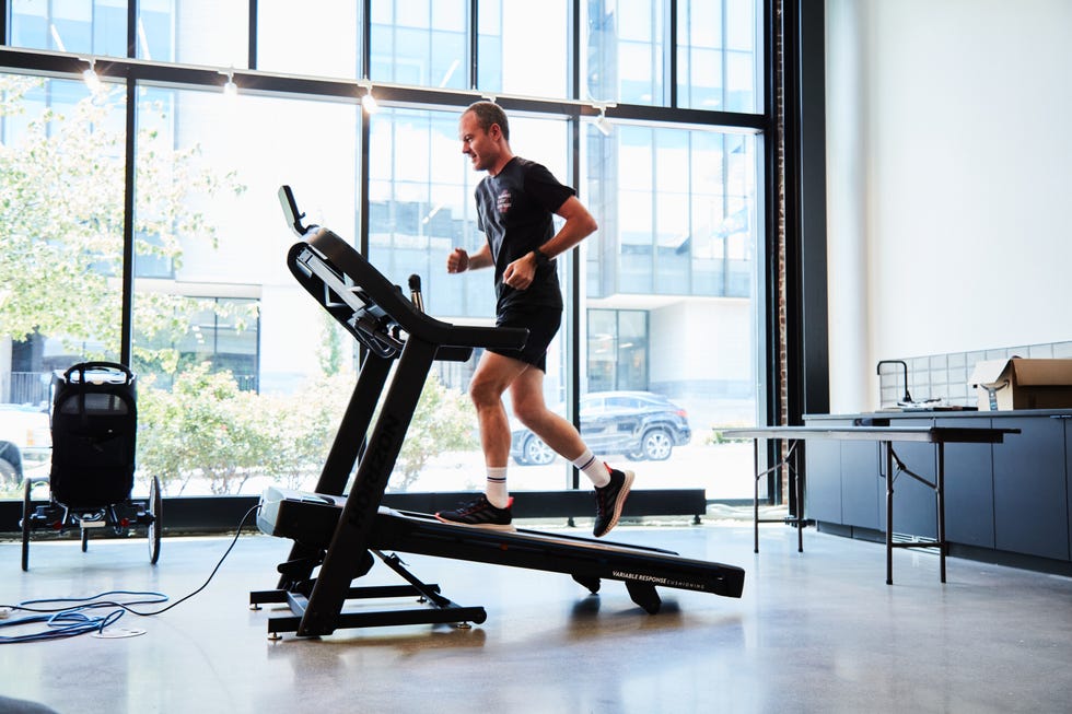 a person running an incline on a treadmill