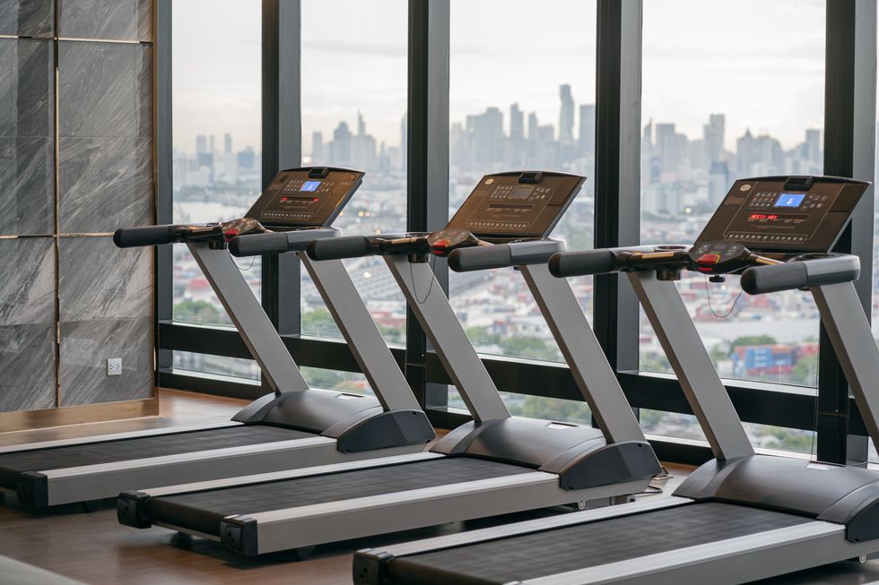 treadmill located inside a gym on a high rise condominium building