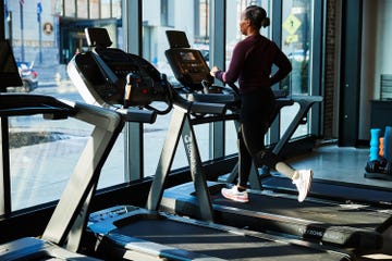 individual running on a treadmill in a gym setting