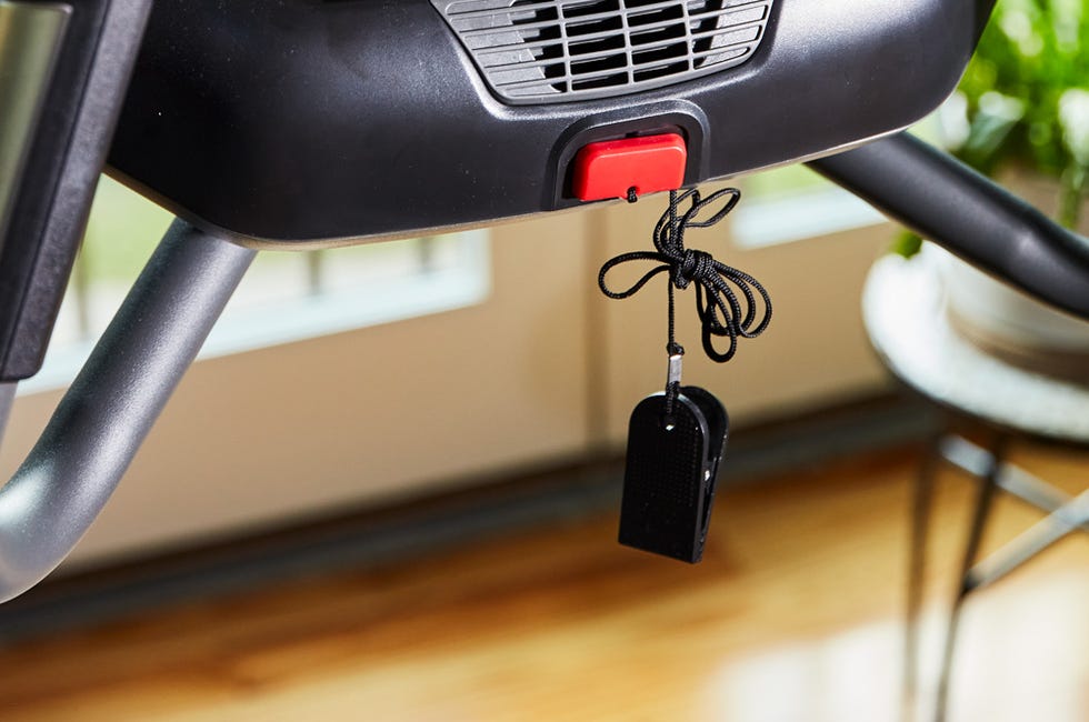 safety key and emergency stop button for a treadmill