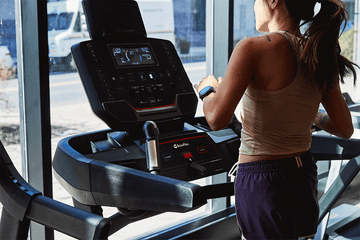 a gif of a runner getting shocked on a treadmill