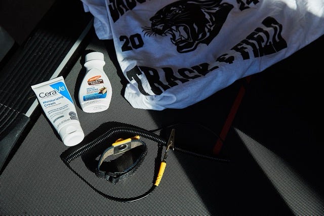 Moisturizing cream and a tshirt displayed in a car