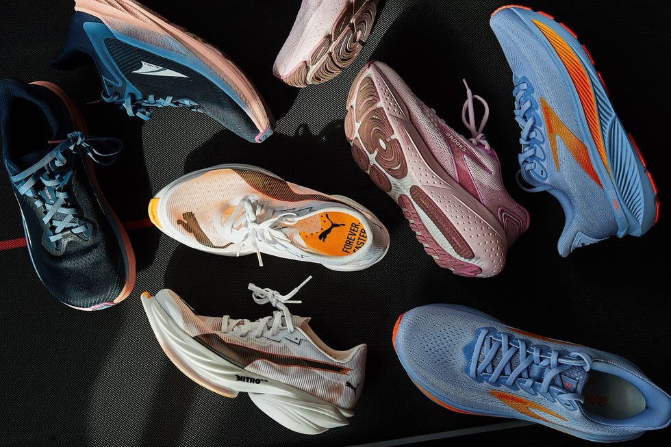 Variety of athletic shoes arranged on a textured surface