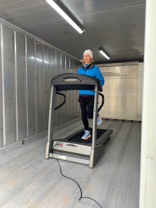 donna urquhart runs on treadmill inside shipping container