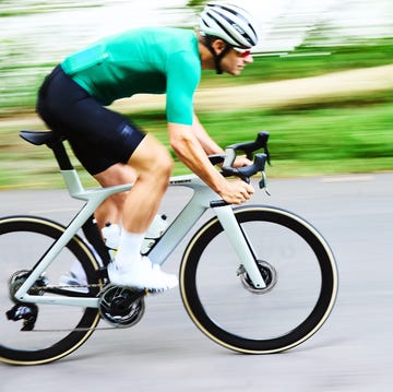 a person riding a bicycle fast