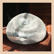 2021 Product Trends - ELLE Decor disco chair by rachel shillander for the future perfect and travertine table by kelly wearstler
