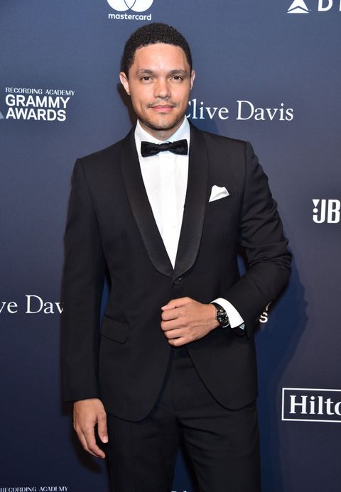 trevor noah wears a tux with a black bow tie on the red carpet