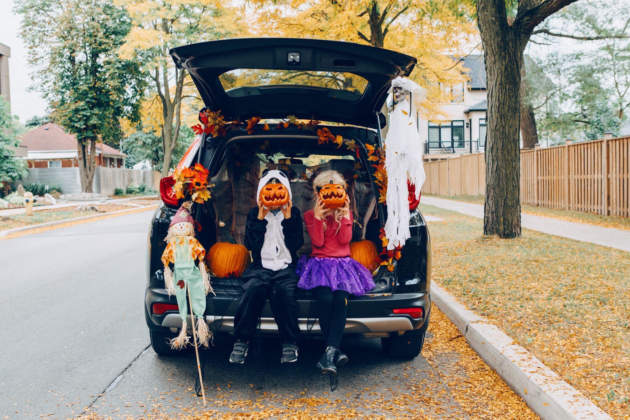 trick or trunk children celebrating halloween in royalty free image 1689187737