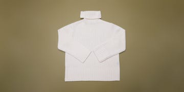 white knit turtleneck sweater displayed flat