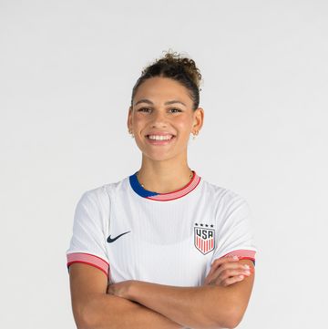 trinity rodman standing with her arms crossed and smiling for her uswnt portrait photo