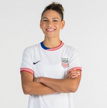 trinity rodman standing with her arms crossed and smiling for her uswnt portrait photo