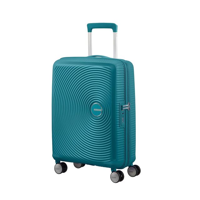 a green suitcase on wheels