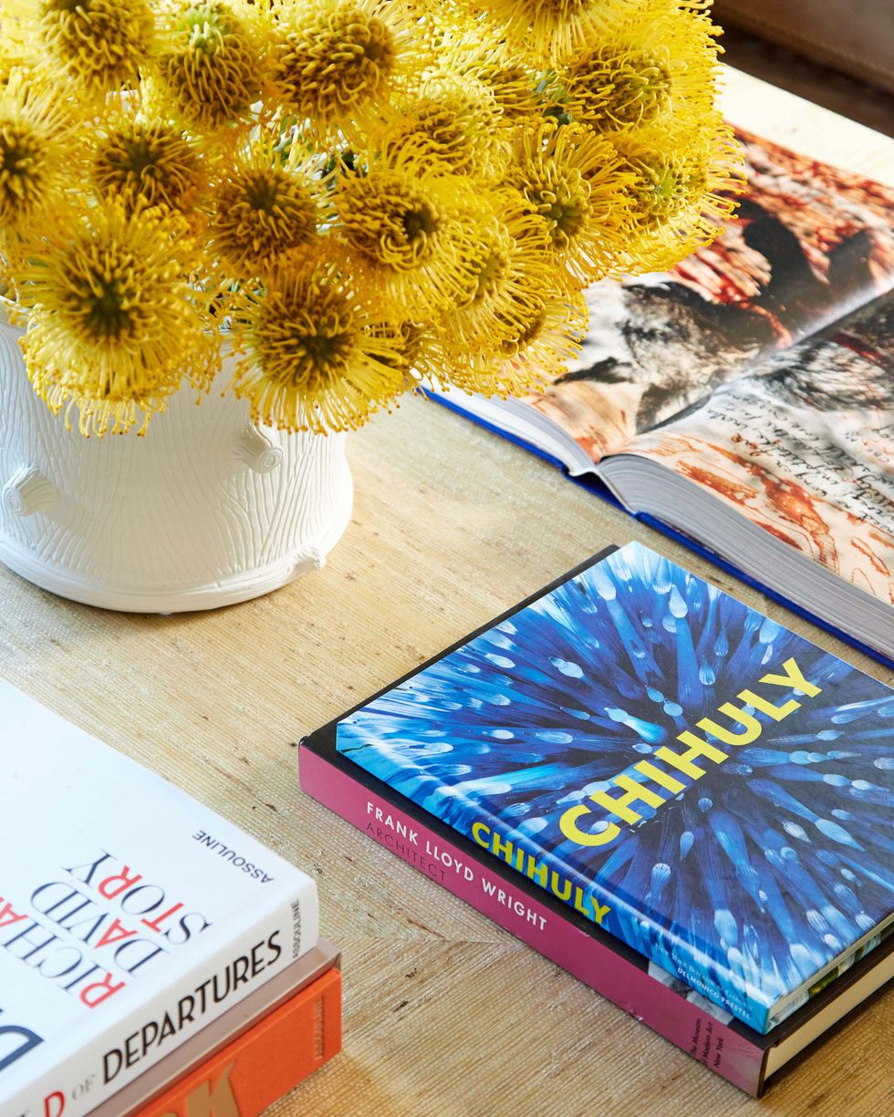 coffee table, books, flowers