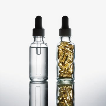 two dropper jars filled with liquid and supplement capsules