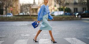 paris, france january 21 leonie hanne wears a blue silky lustous blouse with puff sleeves, a blue quilted lady dior bag, a pale blue leather skirt, dior pointy shoes, during paris fashion week haute couture springsummer 2020, on january 21, 2020 in paris, france photo by edward berthelotgetty images