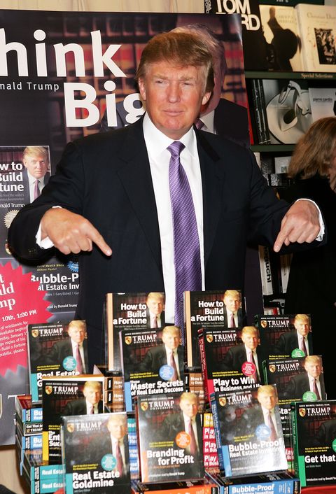 new york   january 10  donald trump gestures as he poses for a photo during an in store appearance to sign copies of how to build wealth, which is a series of nine audio business courses created by trump university, at a barnes  noble store january 10, 2005 in new york city  photo by scott griesgetty images