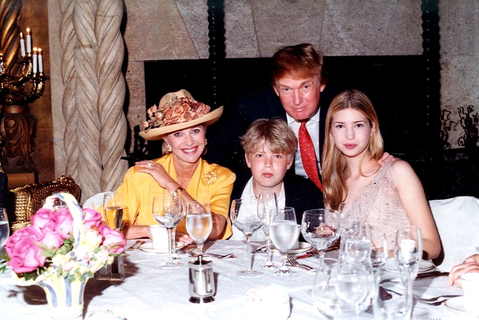 Ivana Trump, Eric Trump, Donald Trump, and Ivanka Trump as they sit at a table at the Mar-a-Lago in 1998