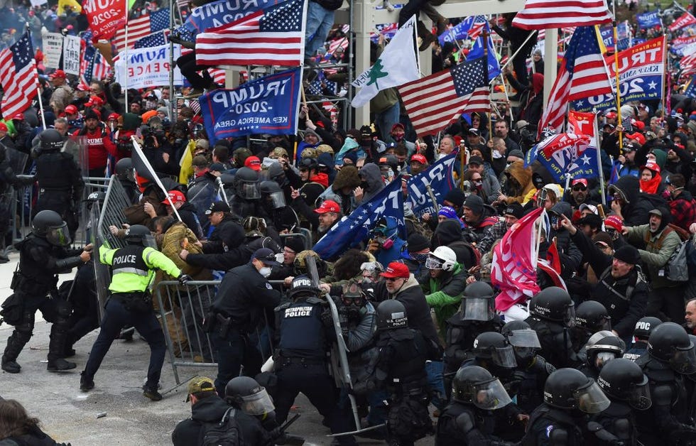 trump supporters clash with police and security forces as they push barricades to storm the us capitol in washington dc on january 6 2021