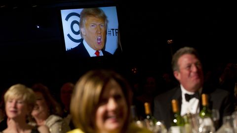 A picture of Donald Trump appeared on a screen as Barack Obama told a joke during the White House Correspondents' Dinner in Washington in 2012.​​
