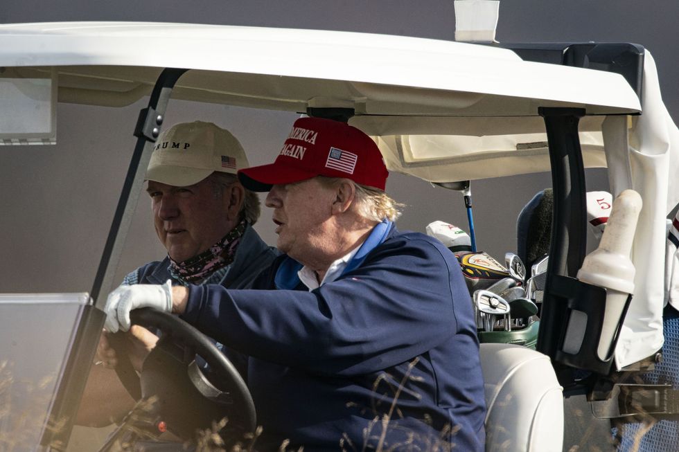 sterling, va   december 13 us president donald trump drives golf cart number 45, as he golfs at trump national golf club on december 13, 2020 in sterling, virginia photo by al dragogetty images