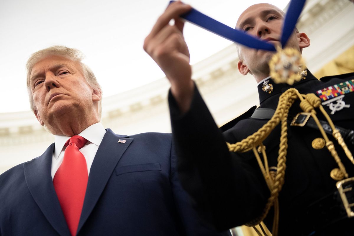 us president donald trump waits to award lou holtz the medal of freedom during a ceremony in the oval office of the white house on december 3, 2020, in washington, dc photo by brendan smialowski  afp photo by brendan smialowskiafp via getty images