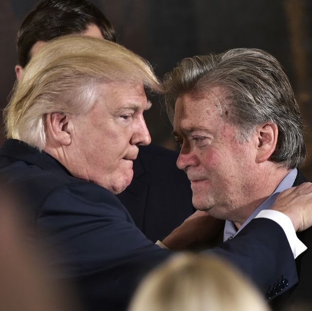 us president donald trump l congratulates senior counselor to the president stephen bannon during the swearing in of senior staff in the east room of the white house on january 22, 2017 in washington, dc  afp  mandel ngan        photo credit should read mandel nganafp via getty images