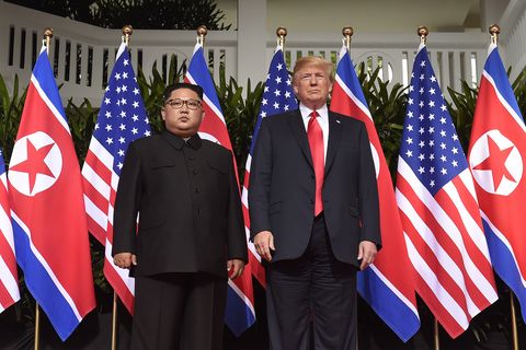 topshot   us president donald trump r poses with north korea's leader kim jong un l at the start of their historic us north korea summit, at the capella hotel on sentosa island in singapore on june 12, 2018   donald trump and kim jong un have become on june 12 the first sitting us and north korean leaders to meet, shake hands and negotiate to end a decades old nuclear stand off photo by saul loeb  afp        photo credit should read saul loebafp via getty images