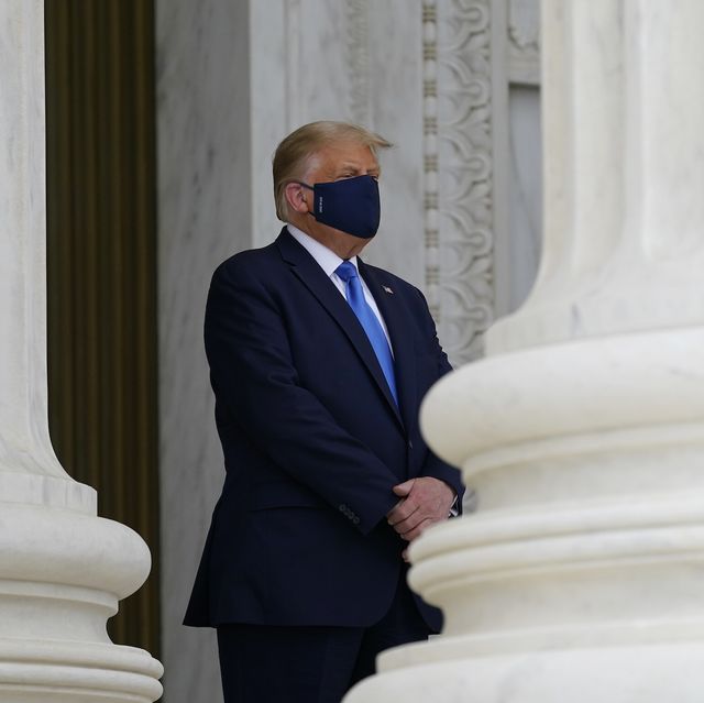 washington, dc   september 24 us president donald trump wears a face mask while paying respects as justice ruth bader ginsburg lies in repose under the portico at the top of the front steps of the us supreme court building on september 24, 2020 in washington, dc ginsburg, who was appointed by former us president bill clinton served on the high court from 1993, until her death on september 18, 2020 photo by alex brandon poolgetty images