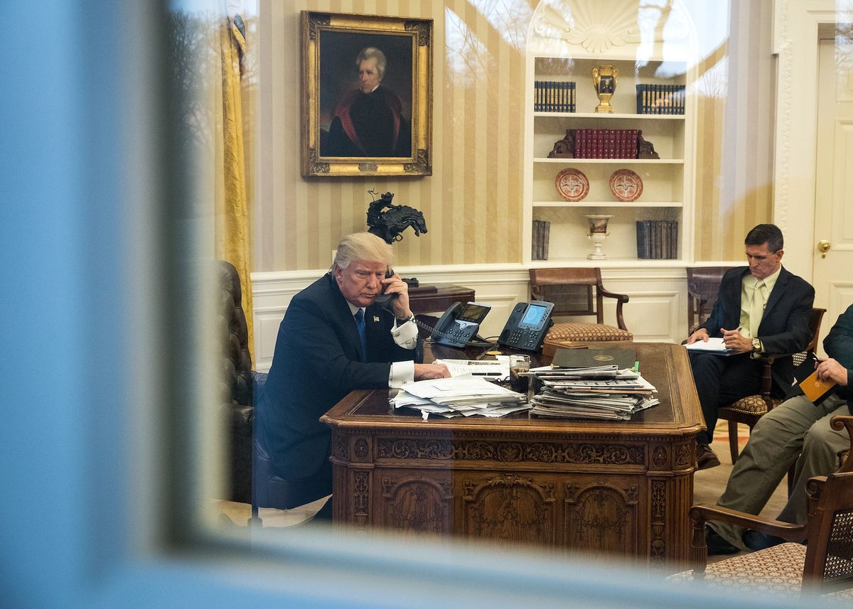 washington, dc   january 28 president donald trump speaks on the phone with australian prime minister malcolm turnbull in the oval office of the white house, january 28, 2017 in washington, dc also pictured at right, national security advisor michael flynn and white house chief strategist steve bannon on saturday, president trump is making several phone calls with world leaders from japan, germany, russia, france and australia photo by drew angerergetty images