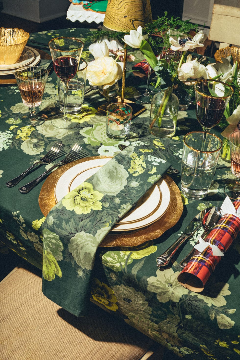 green floral tablecloth with plaid party crackers