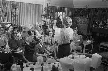 a group of unspecified women attend a tupperware party, some wearing hats fashioned from tupperware products, location unspecified, circa 1955 tupperware representatives hosted tupperware parties, inviting prospective customers into their homes to see the available tupperware product line photo by graphic housearchive photosgetty images