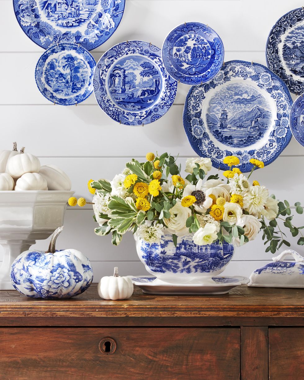 blue transferware tureen filled with yellow and white flowers