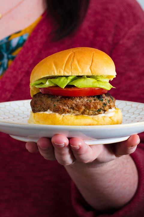 turkey burger with lettuce and tomato on a plate