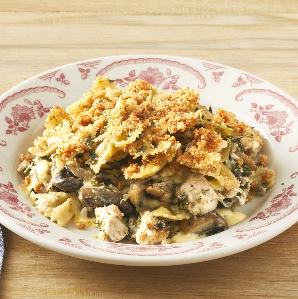 turkey tetrazzini in white and red bowl