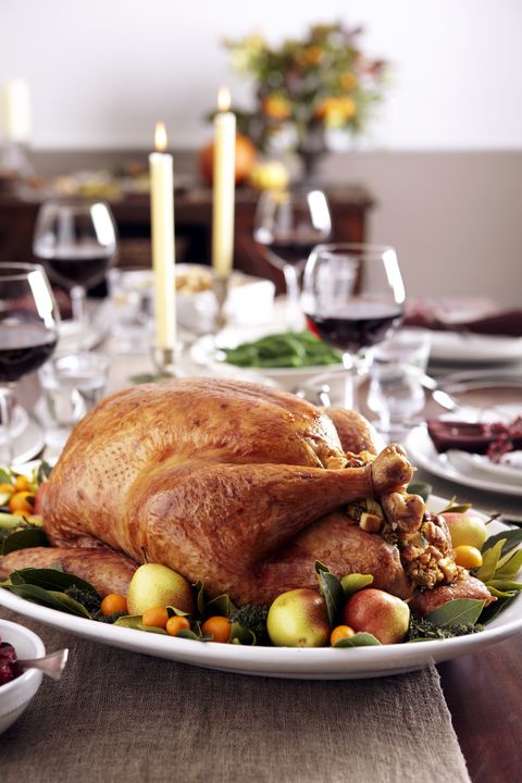 food with zinc turkey dish on table set with wine and candles